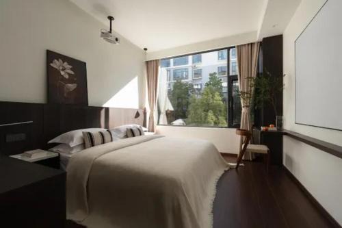 Gucheng House | 山喜丨日照金山雪山全景智慧酒店丽江古城大水车店