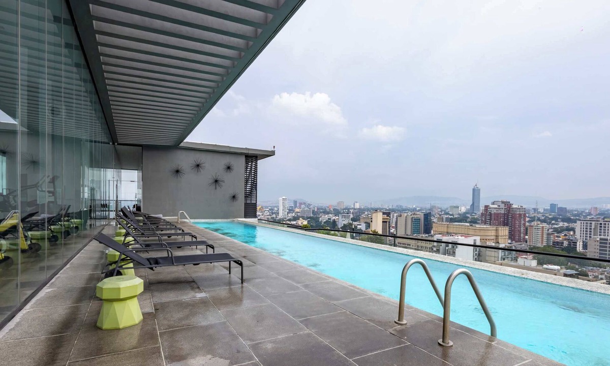 Zona Minerva Apartment | 3BR retreat w/pool, patio & skyline views