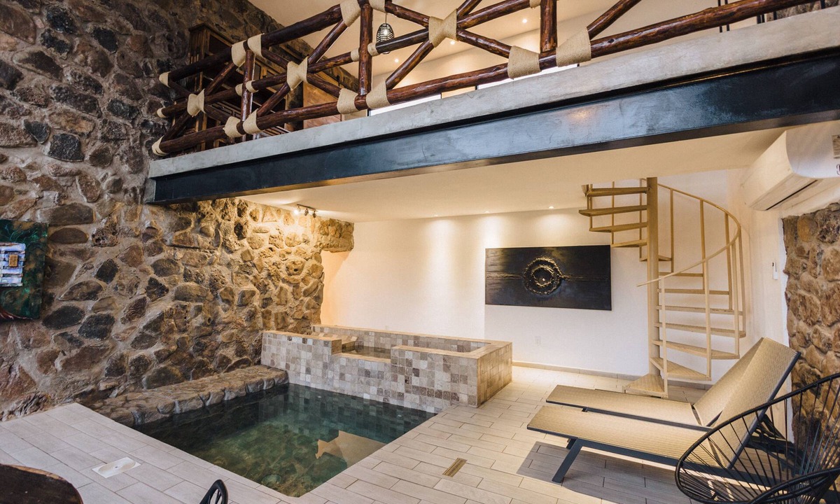 San Carlos Apartment | Climatized indoor pool/studio, stone walls -modern/rustic, very intimate space.