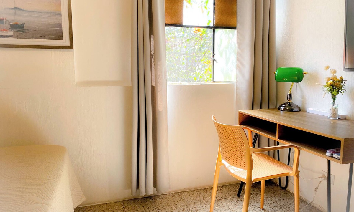 Zona 12 Hotel | Family room with air conditioning. Near Guatemala airport, zone 12.