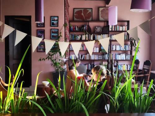 Can Tho House | Here Library - A wooden home by the river with a library