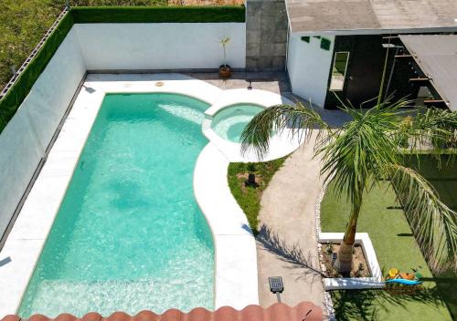 Primera Seccion House | Incredible in-town pool house with BBQ area