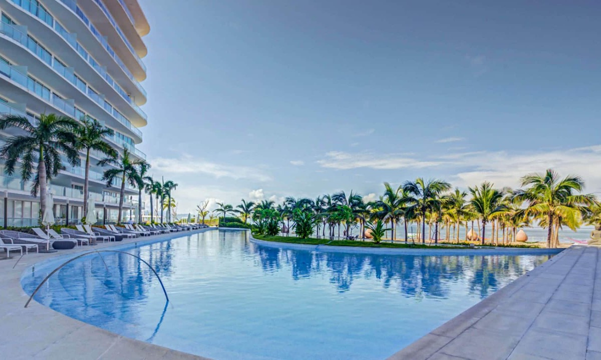 Flamingos Apartment | NEW! Beachfront Marítima Playa Condo, 2 Pools, Gym