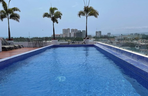 Diaz Ordaz Condo | 1 BR w KING Bed Rooftop Pool Walk to BEACH Prime Location