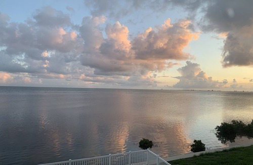 Port Isabel House | Bayfront Home ~close to beach~ Community pool~ hot tub ~ family friendly.