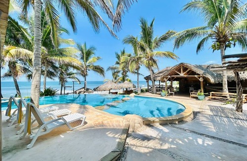 Elota Apartment | Beachfront Space with Pool By PartnerHost