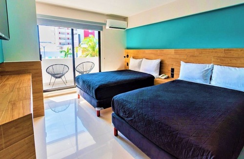 Zona Dorada Hotel | Bright Coastal Deluxe Room Perfect for Relaxing Getaways Near the Shore