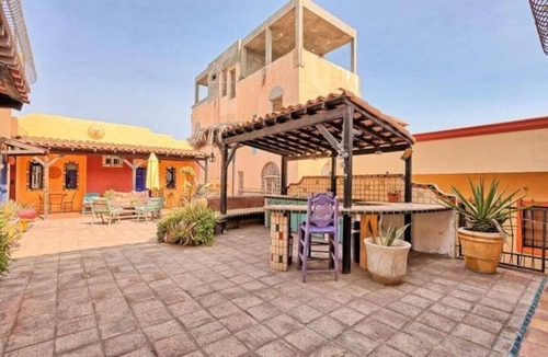El Puerto Apartment | Charming 1-Bedroom Loft in Old Port – Rooftop Views, BBQ Area & Steps to Malecon!