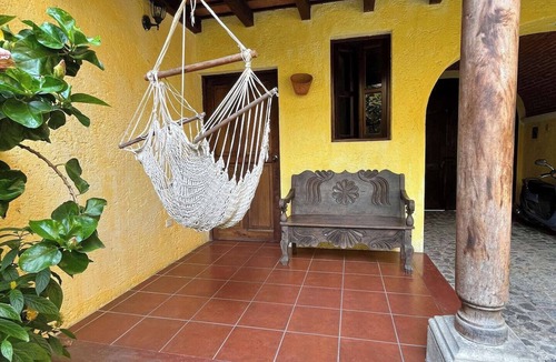Antigua Guatemala House | Charming 3-bedroom family home in a secure, gated Antigua community. Enjoy a lush garden, volcano views from the terrace, and a spacious kitchen. Fully equipped for a comfortable stay, this peaceful retreat is just a 15-min walk from Central Park.