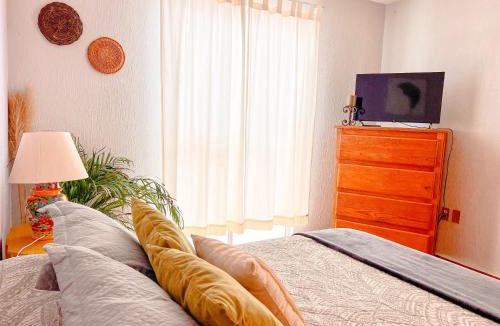 De La Presa Apartment | Colorful family condo with terrace and free parking