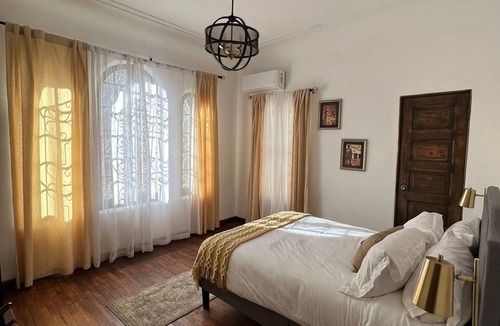 Ciudad Juarez Hotel | Comfortable room in boutique Hotel Villa Reyna in historic house built in 1900!