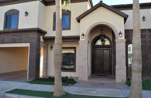 Mexicali House | Dive into the relaxed elegance of our 4-bedroom haven in Zona Dorada, Mexicali's prestigious district, combining comfort, security, and luxury. Ideally nested near bustling plazas, trendy restaurants, and lively casinos, our property is perfect