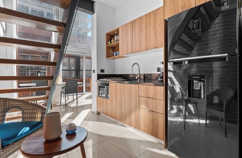North Hotel Zone Apartment | Double-height loft in Zoho Skies | Rooftop pool