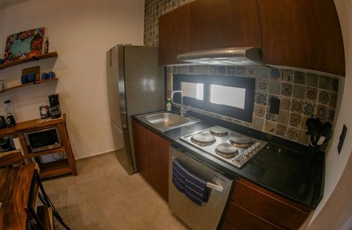 Bacalar Condo | Elegant 2-Bedroom 2-Bath Retreat with Rooftop Oasis & Pool