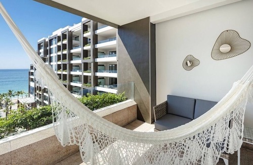 Cabo San Lucas Resort | Elegant 667 sq ft suite with ocean views, balcony, and luxury comforts. Los Cabo