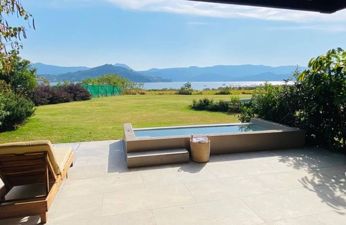 El Santuario House | Lake house with Jacuzzi, pool and paddle court.