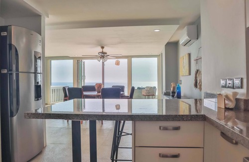 Brisas del Marques Condo | Magical sunsets, king bed, and pro service B403