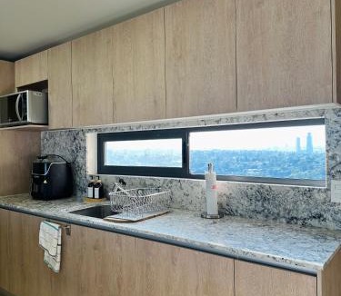 Financial District Apartment | Modern 2BR Condo in Providencia, City Views, Pool & Gym