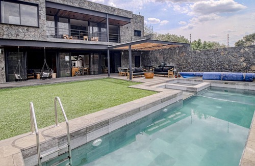 Tepoztlan House | Modern home with a private pool, hot tub, outdoor kitchen, & mountain views