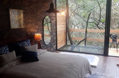 Zapopan Apartment | NEW! Romantic Forest Stay with Hot Tub, Deck & BBQ