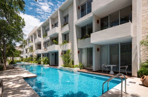 Zama Condo | NHOA 211C Lux 1BR Condo Pool View in Aldea Zama