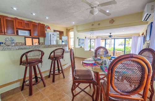 Akumal Condo | Relax at your oceanfront escape on Half Moon Bay. Wake to turquoise views and unwind on your private terrace.