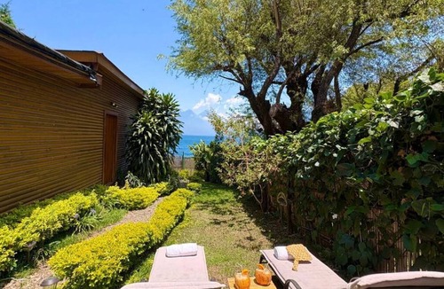 Pasajcap House | “Six Volcanoes”: cabaña con vista impresionante junto al lago