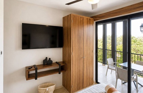 Tulum Condo | Spacious 3-bedroom condominium in Tuk Tulum, ideal for families or small groups seeking comfort, privacy, and strong amenities. Enjoy a private balcony plus access to rooftop pools, paddle court, and underground parking in a great Tulum location.
