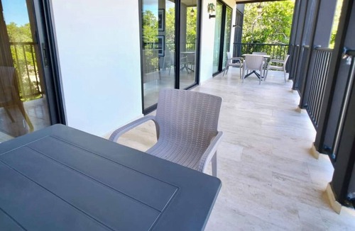 Tulum Condo | Spacious 3-bedroom condominium in Tuk Tulum, ideal for families or small groups seeking comfort, privacy, and strong amenities. Enjoy a private balcony plus access to rooftop pools, paddle court, and underground parking in a great Tulum location.