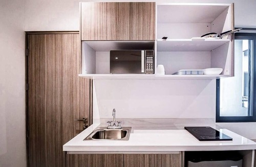 Zazil-ha Apartment | Stylish Condo - Pool + Rooftop - Walk to 5th Ave