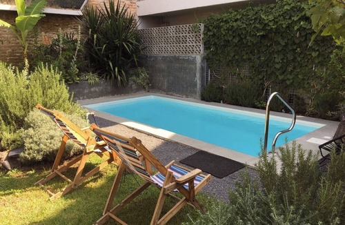 Americana Apartment | Stylish studio apartment in Centro/Colonia Americana—with a pool, balcony, and gardens.