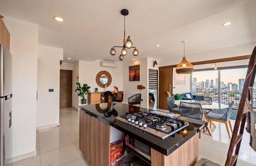 North Hotel Zone Apartment | Stylish Zoho Skies 2-BDR, Rooftop Pool + Parking