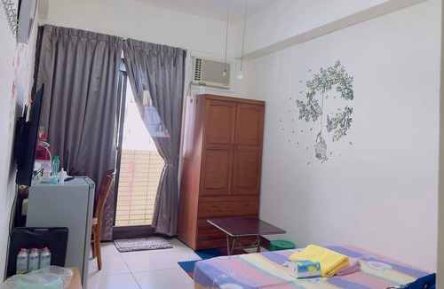 Hukou Apartment | This room have its own private bathroom, bed, cabled tv, wardrobe and balcony.