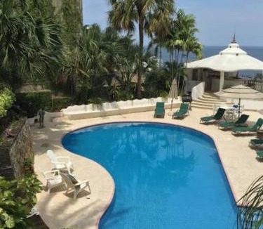 Las Playas Villa | Villa Palmitas acogedor departamento nivel piscina gigante jardines