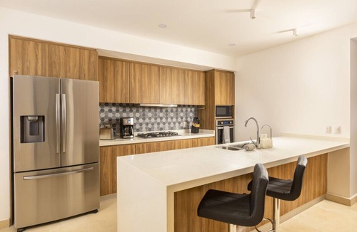 Las Glorias Condo | Wake Up to Paradise – Stunning 2BR Condo Right on the Beach