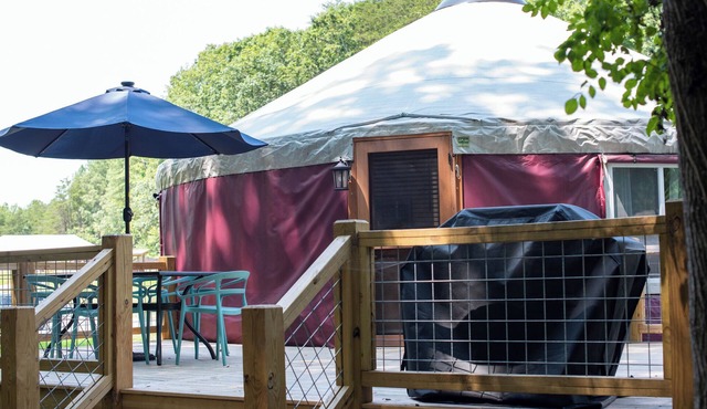 30' Yurt with a large deck, on the creek, full kitchen, dome skylight, 2 bedrooms, sleeps 5. in Mill Spring