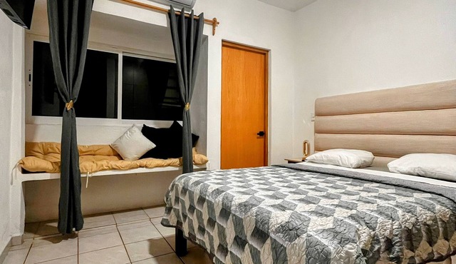 Air-conditioned house, electric gate, covered garage, lovingly decorated.