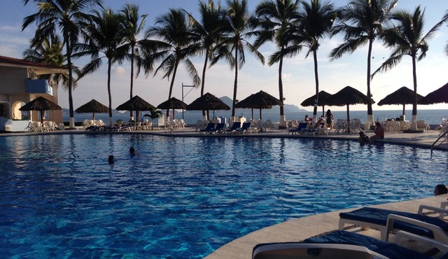 Beach front condo oasis with the best pool in town!