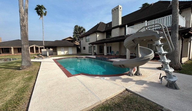 Beautiful Harlingen Home with Heated Pool, Hot Tub, & Waterslide! Sleeps 19!