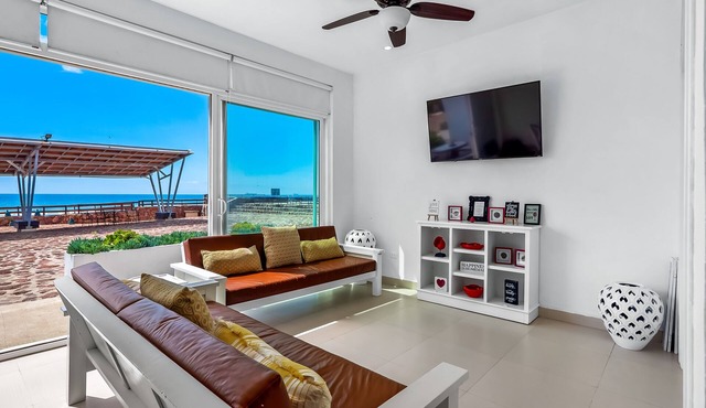 Bright dog-friendly villa with beach views, private patio, outdoor pool, kitchen