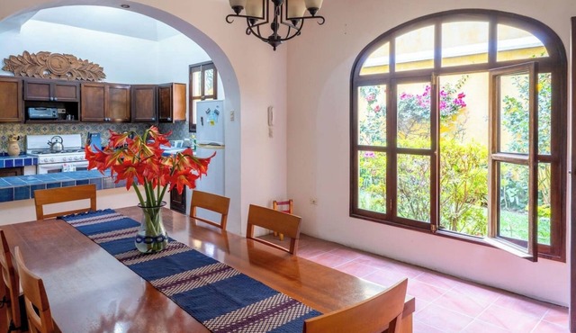 Charming 3-bedroom family home in a secure, gated Antigua community. Enjoy a lush garden, volcano views from the terrace, and a spacious kitchen. Fully equipped for a comfortable stay, this peaceful retreat is just a 15-min walk from Central Park.