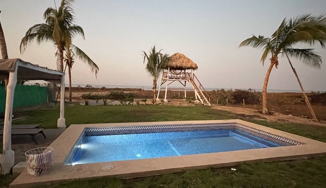 Charming entire home with pool and view tower. Few steps from the beach.