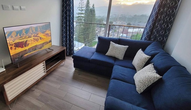 Cozy apartment, your family will be close to everything. City & volcanoes views.