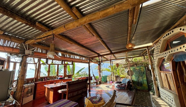 Earthship 3-level apt., portside, connected to an outdoor kitchen with a view.