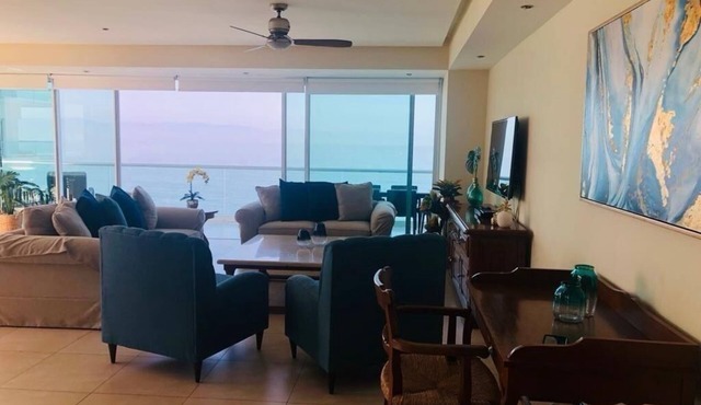 Peninsula Vallarta luxury condo in front of the beach with a pool