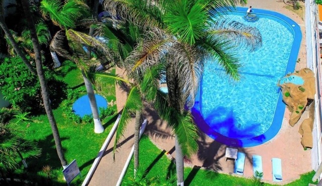 Relax and Unwind in This Sea-View Room with Comfort and Coastal Charm