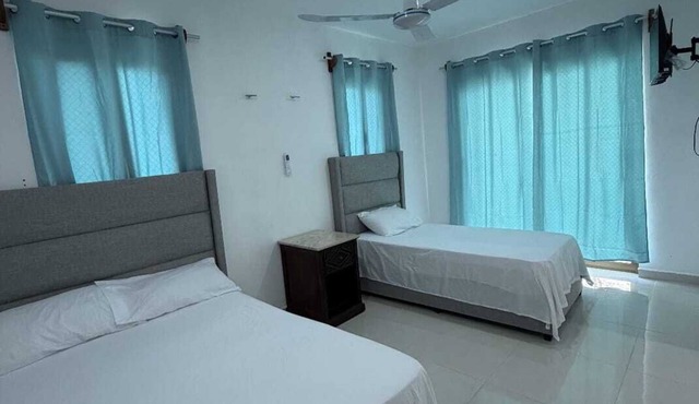 Room with double bed + single bed in Xul-Ha in Xul-Ha