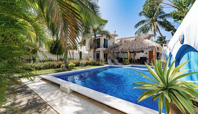 Serene Escape with Pool Surrounded by Lush Gardens