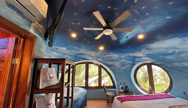 Two-story, two-bedroom oceanfront suite with private jacuzzis and full kitchen.