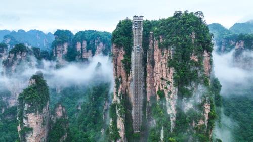 Zhangjiajie Cloudscape Villa - New Hotel, Free Private Car Rides to South & East Gates of Zhangjiajie National Forest Park,Free Private Car Rides to & from Airport,Chinese-Western Breakfast, Coffee, Tea & Fruit, Free Laundry & Dryer, Ticket Guidan